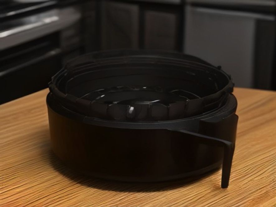 Close up of worn nonstick coating on an air fryer basket