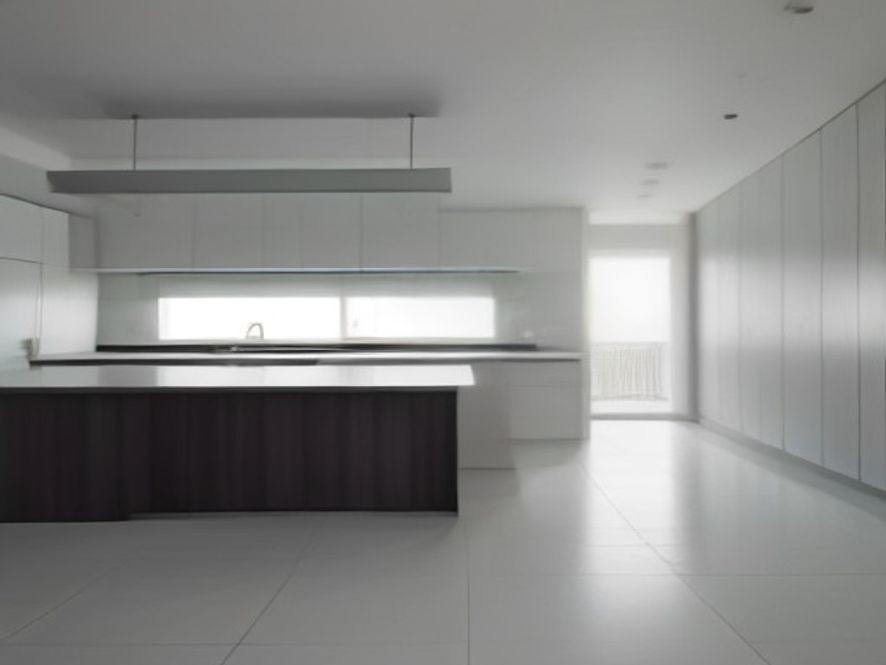A perfectly maintained open-concept kitchen bathed in clear natural light.