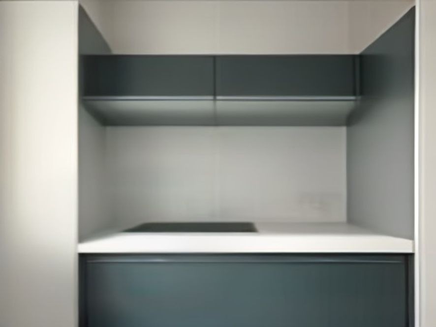 Non-permanent storage upgrades including tension rods and adhesive hooks in a cabinet