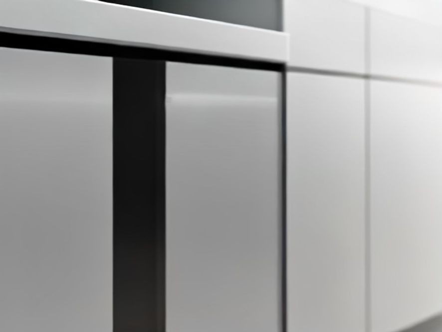 Immaculate silver cabinet handle on clean white kitchen cabinetry
