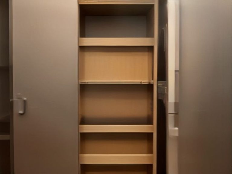 Slim pull-out pantry tower providing food storage in a small kitchen.
