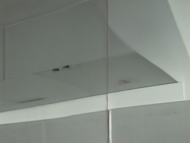 A sparkling stainless steel stove hood vent free of dust and grease.