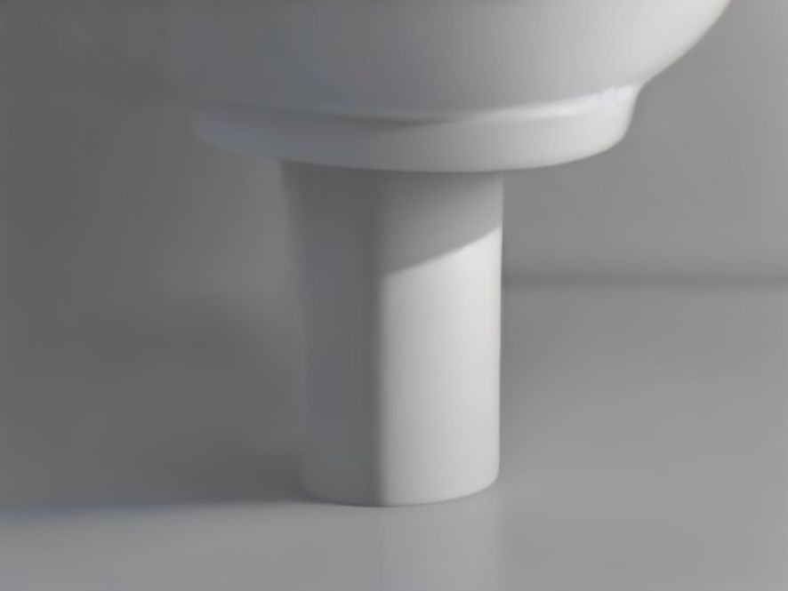 An air admittance valve fitted to the top of an under sink drain pipe stack.