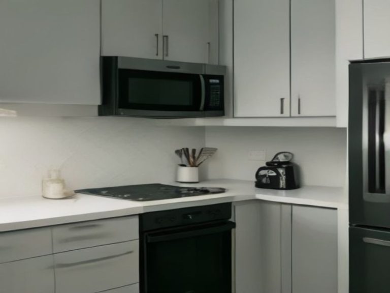 Kitchen countertop with major small appliances in a modern home setup.
