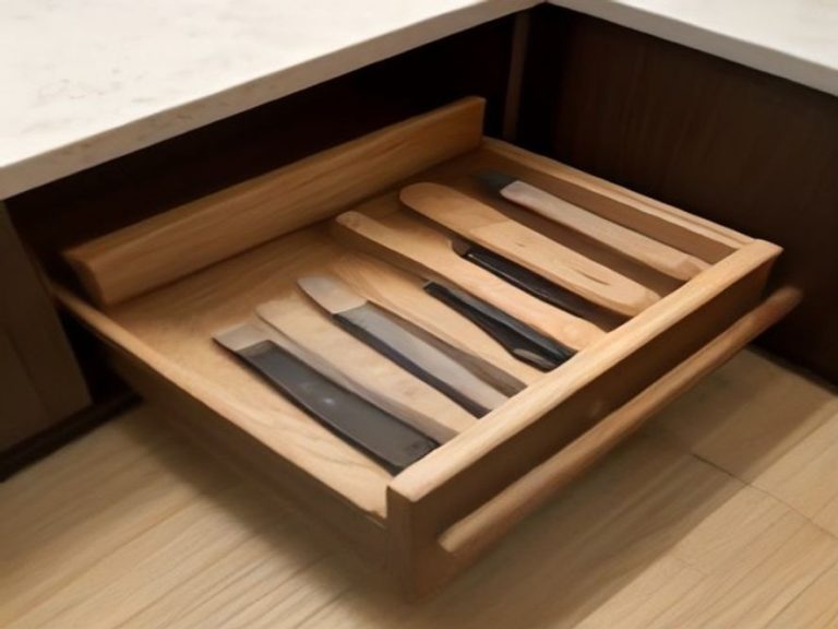 In-drawer wooden knife block storing kitchen knives safely and compactly