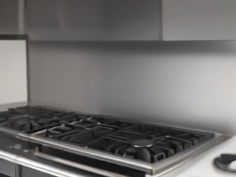 A spotless stainless steel stove backsplash reflecting warm kitchen lights.