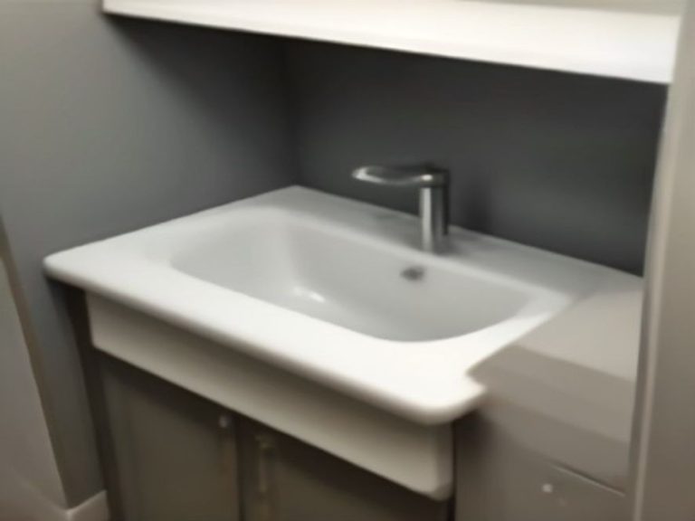 Well maintained under sink plumbing with pristine pipe joints and connections.