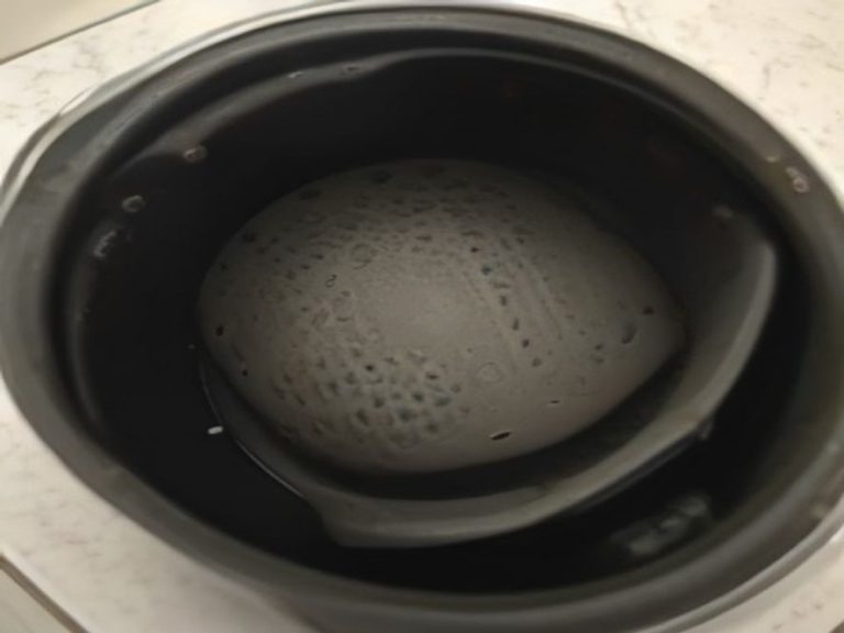 Perforated silicone liner inside an air fryer basket to prevent sticking