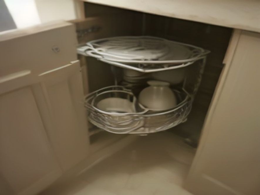 Pull-out shelf mechanism for small appliance cabinet storage.