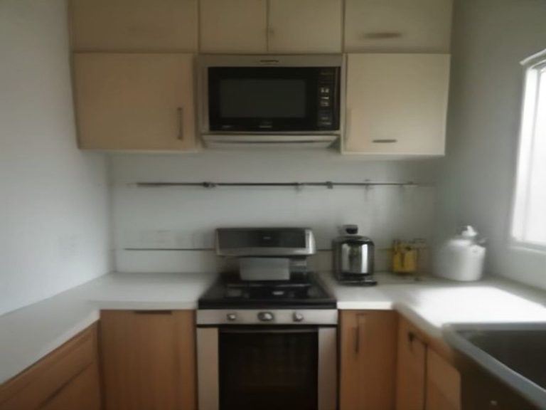 A row of spotless countertop appliances in an organized residential kitchen.