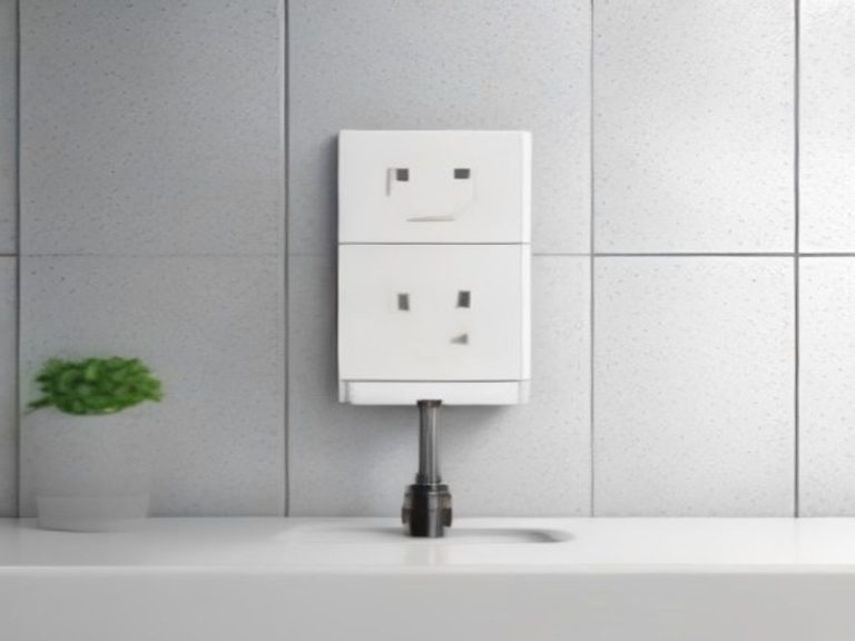 A GFCI safety outlet installed on a tiled kitchen backsplash wall.