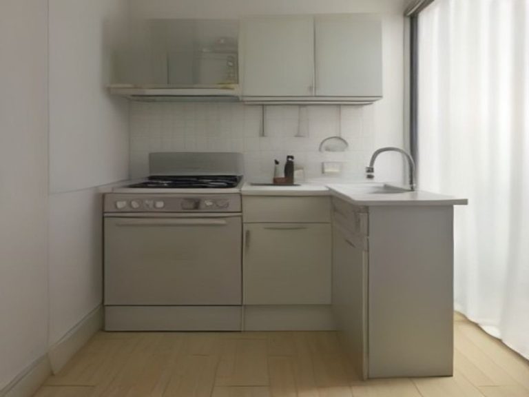 An organized compact kitchen counter with neatly arranged small appliances.