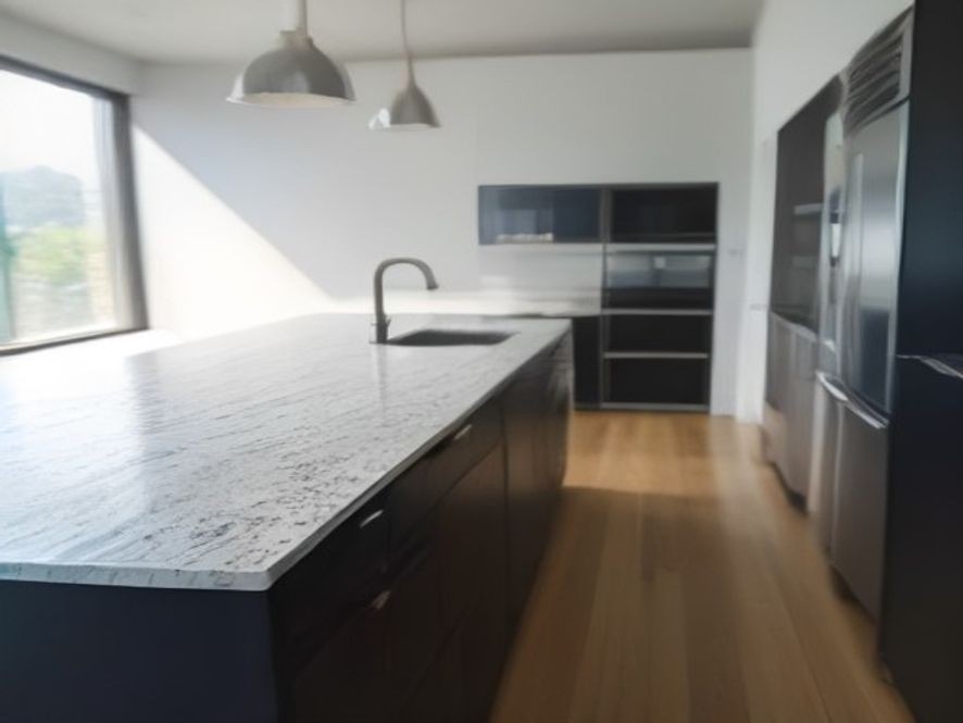 Various sparkling clean kitchen surfaces including granite and stainless steel