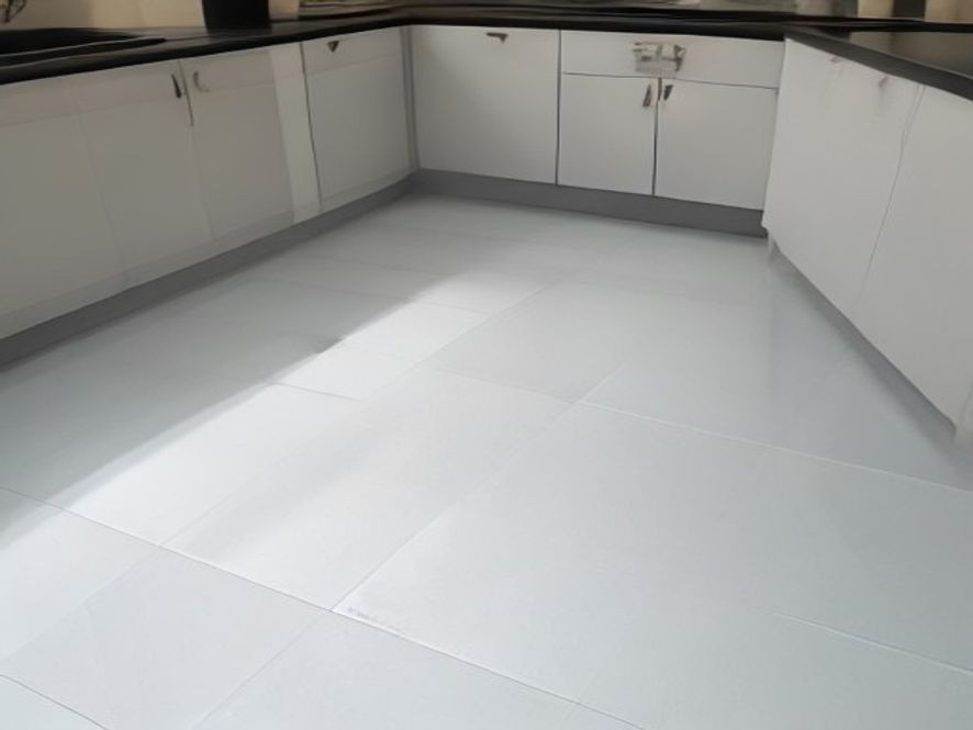 Immaculate ceramic tile kitchen floor with crisp grout lines