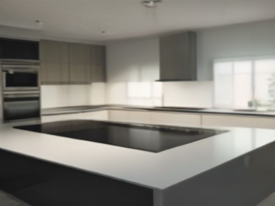 Sparkling clean glass cooktop and surrounding quartz counter surface