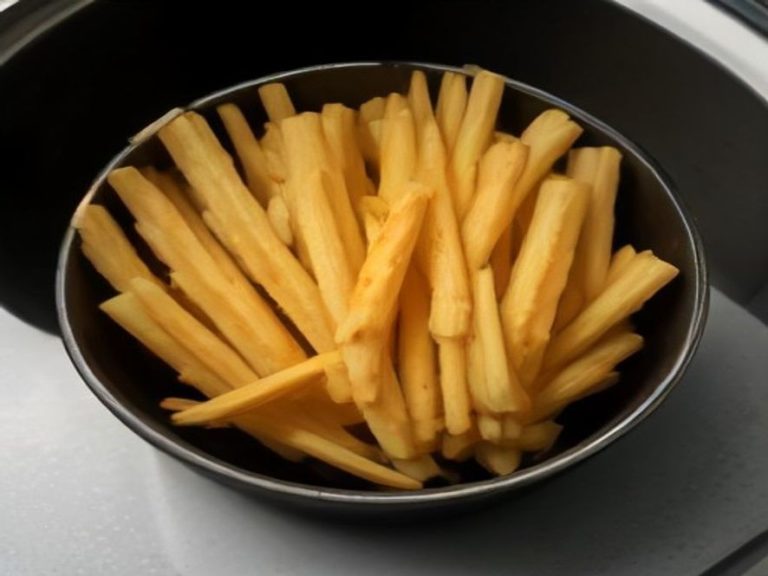 Soaking raw potato sticks in water before air frying for extra crispness
