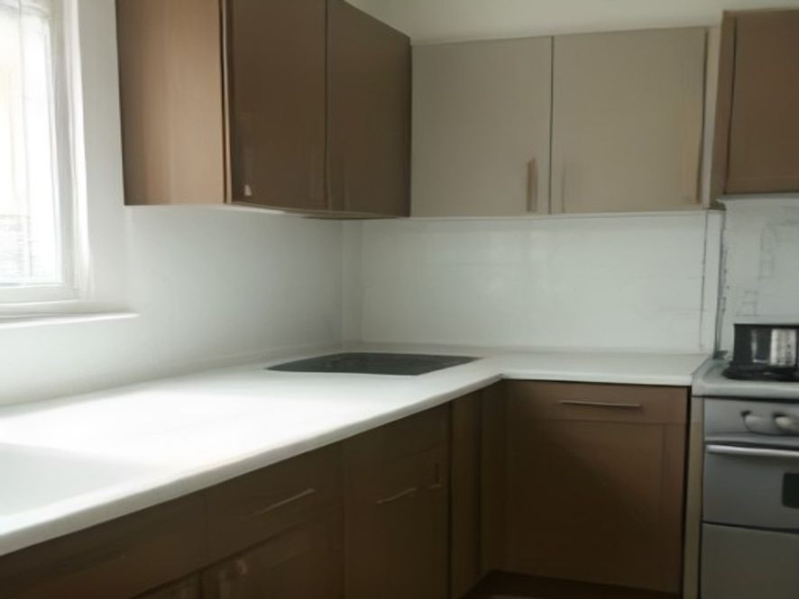 Clean shaker cabinets above a bright marble kitchen countertop