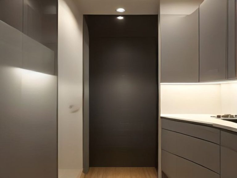 LED lighting illuminating clear storage bins inside a deep kitchen cabinet