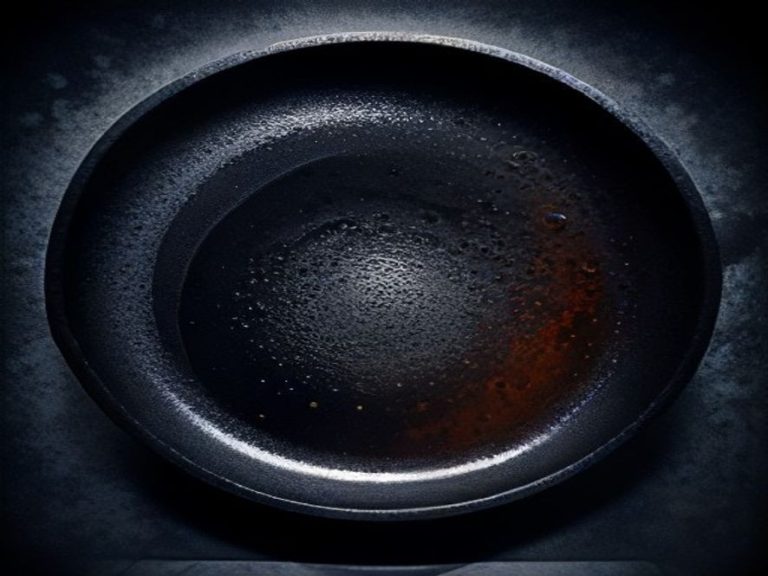 A well-seasoned cast iron pan on a clean stovetop.