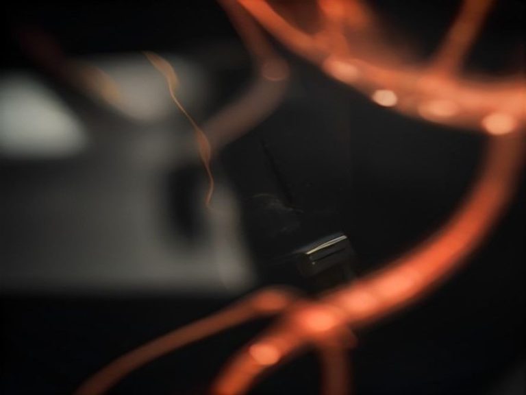A close up view of a vibrating transformer inside an appliance.