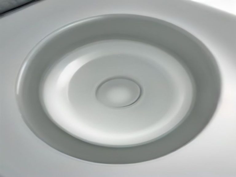 Close-up of a kitchen sink drain flange assembly