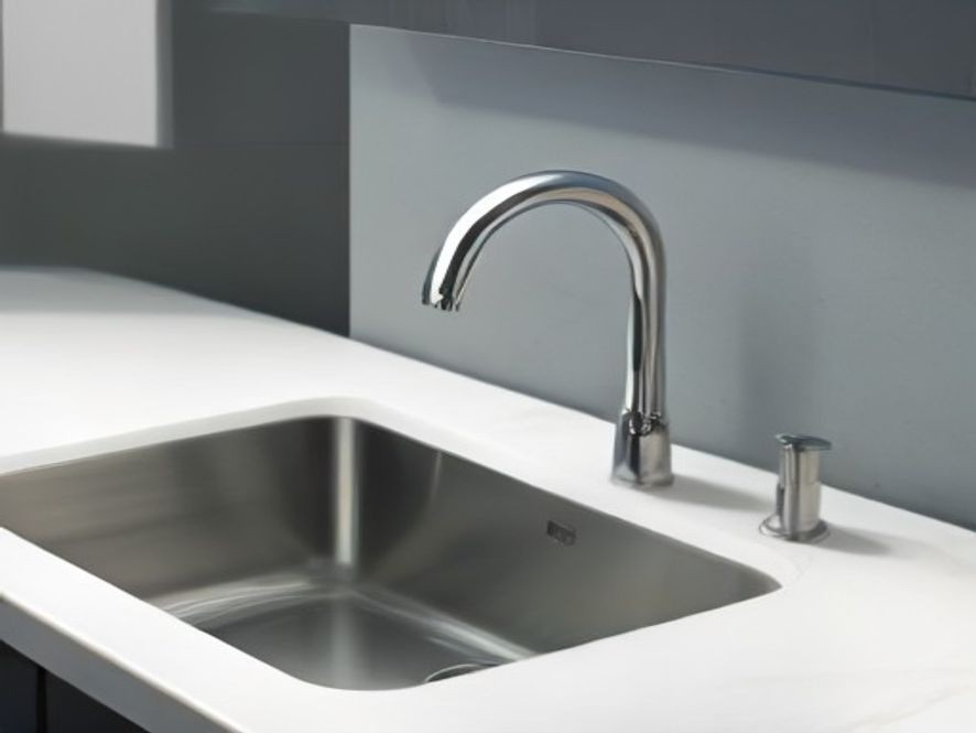 Weak stream of water flowing from a kitchen faucet