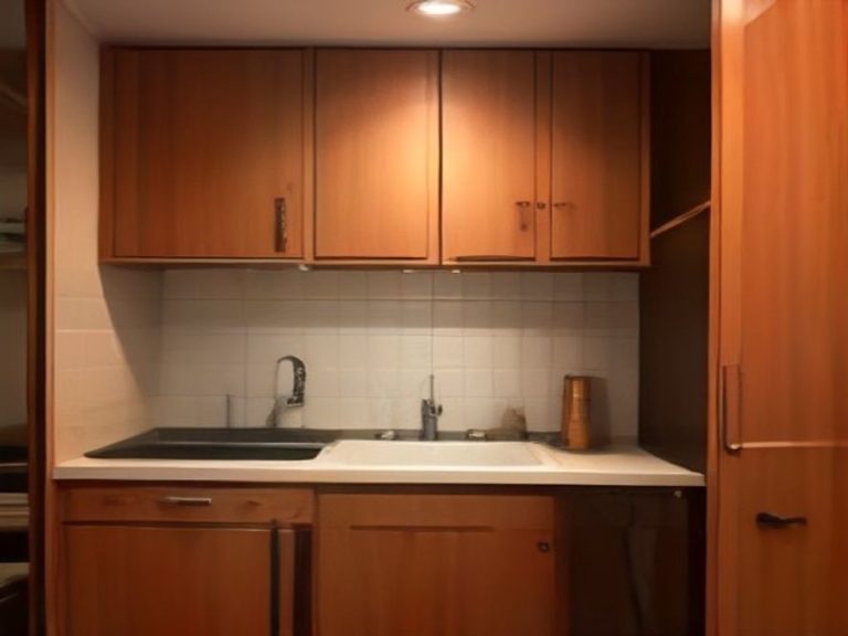 Plumbing pipes secured with brackets inside a cabinet